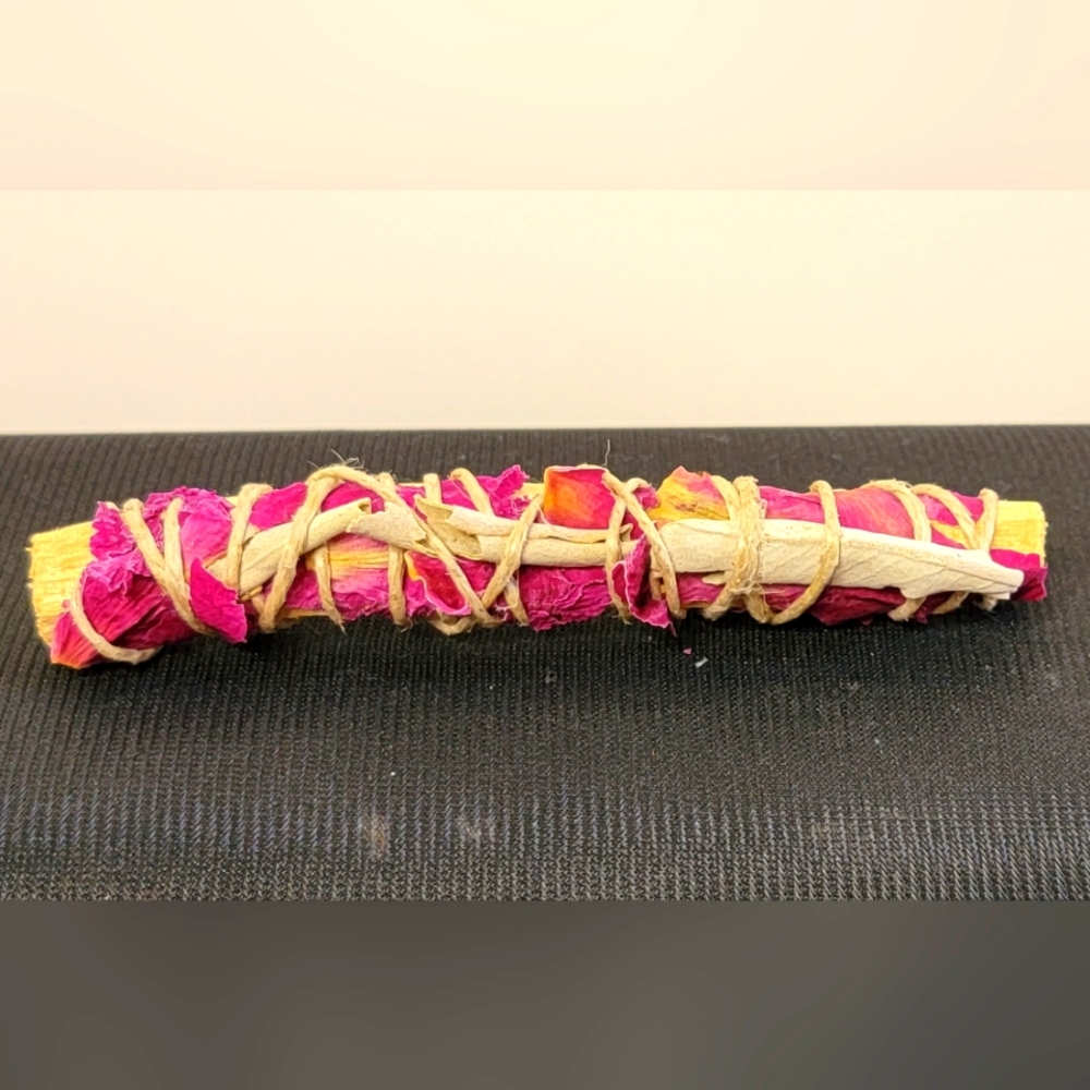 Spiritual smudge stick in Rose, sage and Palo Santo estimate 3 in long.